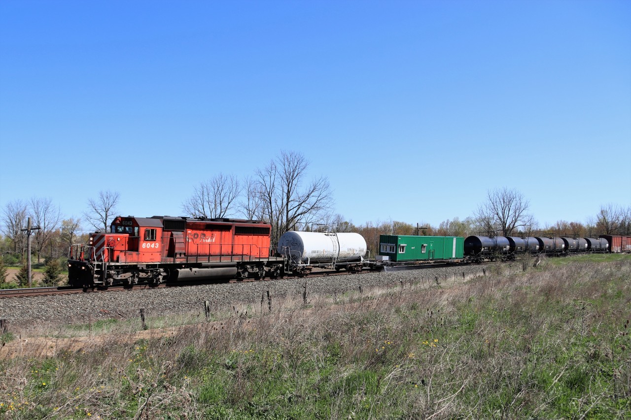 With what has been going on lately on this stretch of the Galt sub, getting one train in daylight if we are lucky, to seeing 3 trains by 10:30 am was a nice change. CP 235 waited at Guelph Junction for CP 234 to pass and then headed west. Shortly after, this one showed up. The annual weed sprayer, led by CP 6043. The SD40-2 wasn't looking the best physically, but it always nice to get a train with one of the few remaining leading.