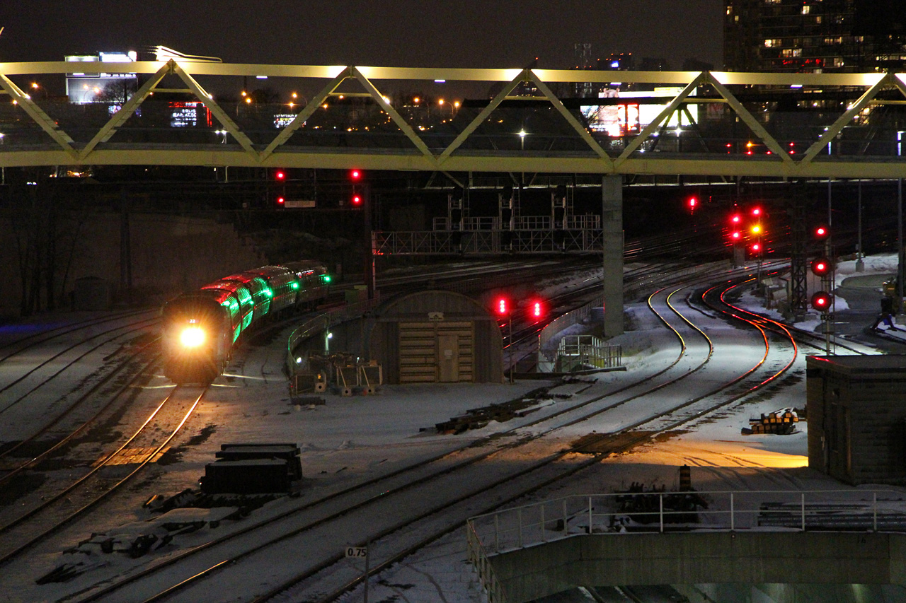 Christmas is over, but the Union Station Rail Corridor is putting on its own version of a light show. The "Maple Leaf" has discharged its passengers, and is backing out to Mimico for servicing, with the Amfleet cars briefly adding green to the reds, yellows, and whites bouncing off the rails in downtown Toronto.