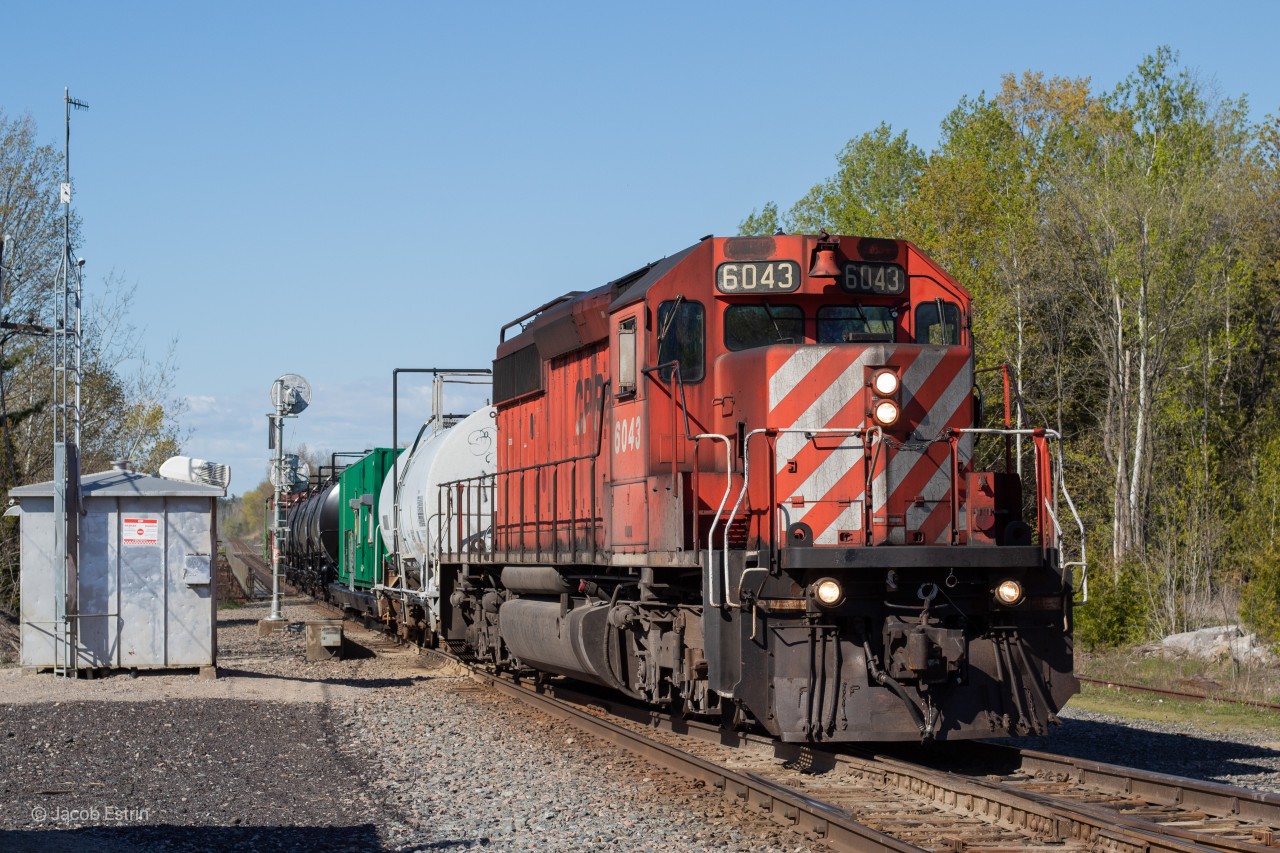 After waiting for almost an hour for CP Police to clear a car on the right-of-way CP 6043 and it's spray train continue West into the siding at Cherrywood where they will have to wait for 118 to pass before they can continue to Toronto Yard. Also, this is my first shot on my new 50mm lens, I don't think it turned out that bad!