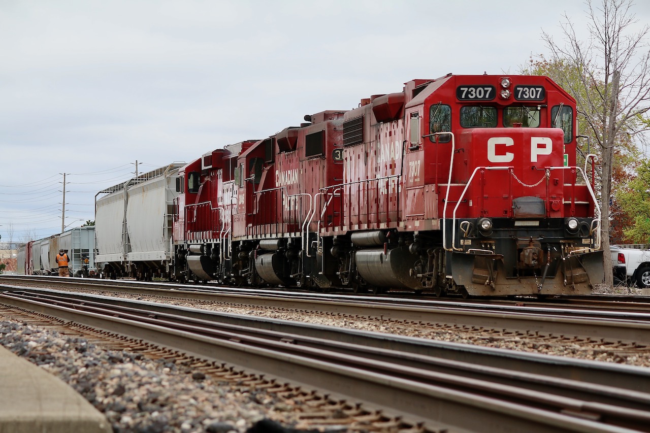 A very rare three unit consist on local T14 today in Streetsville today with former D&H GP38 7307 up front. The train is in the process of working the yard while its Toronto bound cut of cars waits, complete with EOTD armed on the siding in the background.