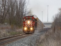 CP ballast train throttles out of Darlington bound for NY. Grabbing a string of racks from Agincourt holding nothing back with the sand on and all flying for Smith Falls.