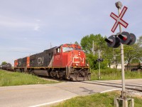 A short Cn 439 comes down a good old crossing, which is not too common to see nowadays, during 30+ degree weather on a May day.  