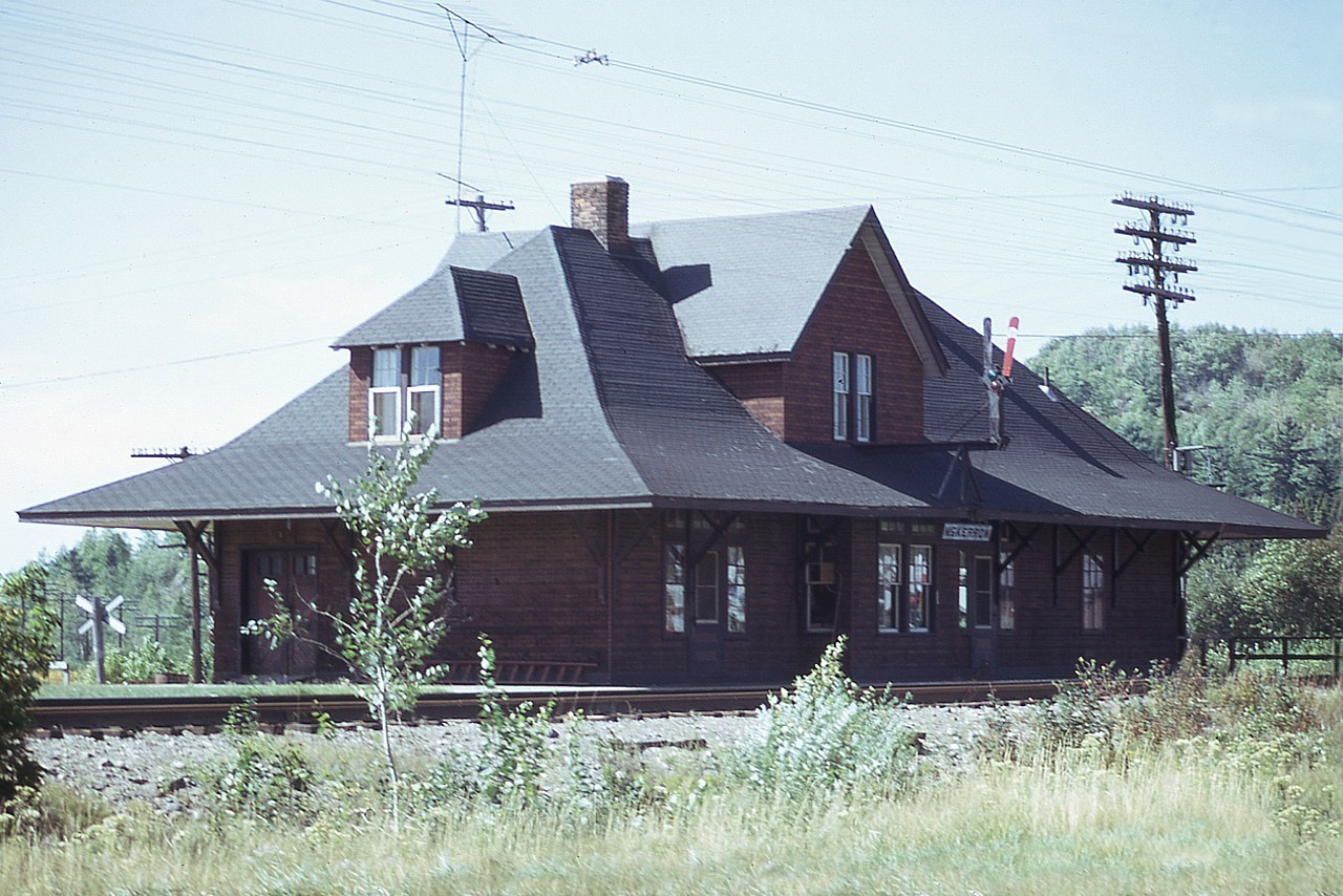 This outdated structure was torn down in the early 1980s. McKerrow station had outlived its usefulness, and like many others along the northern lines; living quarters for now departed agents was a thing of the past. Replacing the building was a modern compact MoW office and storage building. And the Huron Central power has replaced the CP.
Note in 1976 this station was still active. It was located at the junction of the CPR and the old Algoma Eastern that came up from Espanola (Little Current Sub) only a couple of miles south. The location, with its small yard and wye is still rather active; due to its proximity to the Pulp and Paper mill at Espanola. Driving that long stretch from the SOO to Sudbury, following the HCR can be rather quiet, but usually something can be found on the line working at McKerrow.