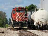 Ontario Southland Railway (OSR) Job #1 with GP9u's 1591 and 1620 looks over it's lengthy lift on the newly built interchange track at Dawson Road in Guelph on the North Spur. The cars on the right were just left by CN L542 seen in the background and were the first cars to roll over this newly installed rail on the Guelph Junction Railway. CN L542 was reversing to the WestRock of Canada facilty with several boxcars, which was powered by GMTX 2279 and CN 1408. 