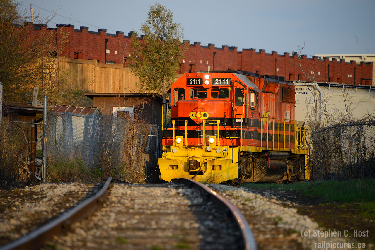 Rounding the bend on the Fibreglass spur, 583 is reversing past the Biltmore Hats condos in the last good rays of sunlight before shadows take over as they head to the Owens Corning plant. Rolling past a gaggle of brownfield sites rapidly converting to housing, Guelph's St Patricks ward, once the low income part of town (which I lived in in its prime), is rapidly gentrifying and soon the railway will have hundreds of neighbors to contend with. As the train reverses toward the plant, it encounters a bit of a climb up then descends down toward the factory as it is located beside the Speed River, the lowest point in town. Many of the Ward's factories and warehouses have converted to housing and no doubt more conversions are coming, but Fibreglass continues operations in 2021 in a nod to decades past where railway customers were everywhere. At least GJR can say every inch of track is still in service on their railway.