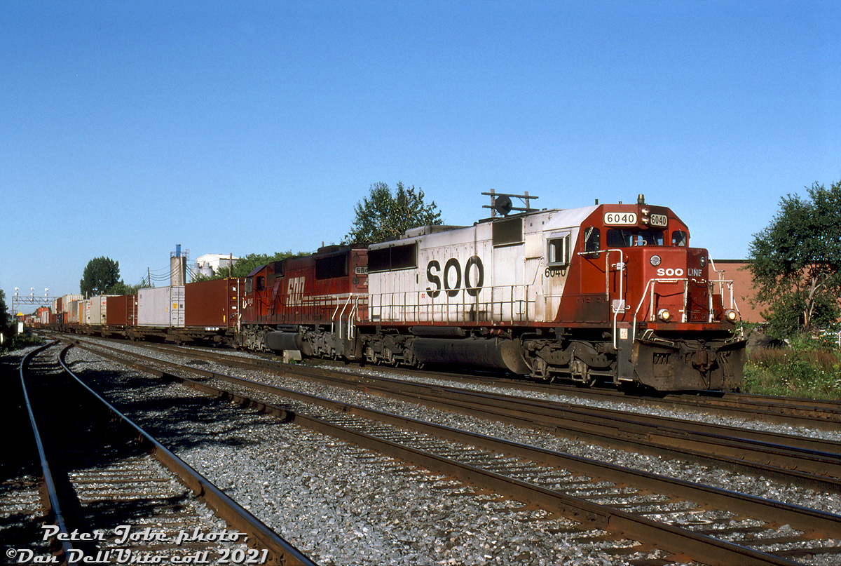 Back to back SOO Line SD60's, as with other SOO power, were common in Southern Ontario on CP freights back in the day. On one sunny morning in August 1999, SOO SD60 6040 and 6045 (both in as-delivered liveries, as starting with 6042 SOO switched from red/white to all-red) head up CP intermodal #502, exercising trackage rights over CN's Oakville Sub as they enter CP's Canpa Sub at Canpa (the west end of Mimico). From there they'll swing north and head up the Canpa to Obico Yard. Both today survive on CP as rebuilt 6200's.

Peter Jobe photo, Dan Dell'Unto collection slide.
