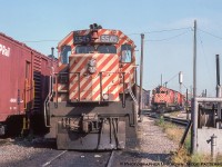 GMD and MLW power is found laying over by the Windsor roundhouse, seen between the sets of power with 5545's set on the roundhouse lead and 4727's set on the fuel and sand track.  MoW equipment lines the shop track at left.  Built circa 1911, the roundhouse lasted until June 2010, though the turntable remains.<br><br>CP SD40 5545, built 1967, upgraded to SD40-2 standards, sold to DM&E 6073 in 1999, sold to Larry's Truck & Electric, May 2016.  CP M636 4727, built 1970, retired 1993, scrapped 1994.<br><br>More at the Windsor roundhouse:<br><a href=http://www.railpictures.ca/?attachment_id=42099>Big power on the table,</a> February 1977 by David Parker.<br><a href=http://www.railpictures.ca/?attachment_id=10932>Pups going for a spin,</a> March 1998 by Geoff Elliott.<br><br><i>Original Photographer Unknown, Jacob Patterson Collection Slide.</i>