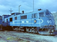 A great location to photograph WP&Y locomotives. Everything was shut down and all was peaceful. The blue painted locomotives & vans were resting in front of the two stall wood frame engine house & some of them were easy to photograph. It was easy to see that the locomotives had led a hard life. One had it's snow plow blade missing, & others had their blades bent due to plowing rocks off the tracks. I guess that I was lucky to be sent there in 1982. Was happy to see the railway operating. At the time I did not realize WP&Y was about to shut down. Lots to see in the Yukon! Beautiful scenery, & lots of nice people. 

My Latitude/Longitude location may be a little off as all the old landmarks are gone.