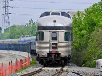 VIA's #1 has just crossed the CP diamond at Davenport and is headed north to Snider before its will wye the train and head east on CN's York Sub and north on the CN Bala sub on its journey to Vancouver.
According to the VIA website:  
Classes
Both Sleeper Plus (cabins for 1 and cabins for 2 only) and Economy classes will be offered, but Prestige class will not be available.
Seating
Passengers will be required to remain in their cabin and assigned seat.
Meals
The Dining car will be open to Sleeper Plus passengers for breakfast and dinner. A reservation system will be in place to allow and control access. Lunch will be provided in-cabin only and will have to be eaten in cabins. The menu and bar service have been modified.
A new at-seat food cart service will be offered in Economy class. The menu and bar service have been modified.
Park car and Skyline
Unfortunately, the Park car and Skyline car (lounge/dome cars) will not be accessible to any passengers.
I am not sure about you, but the biggest attraction about taking the train across Canada is to see the country in  one of the Budd domes. I think I would rethink my trip until I had access to the dome car.
