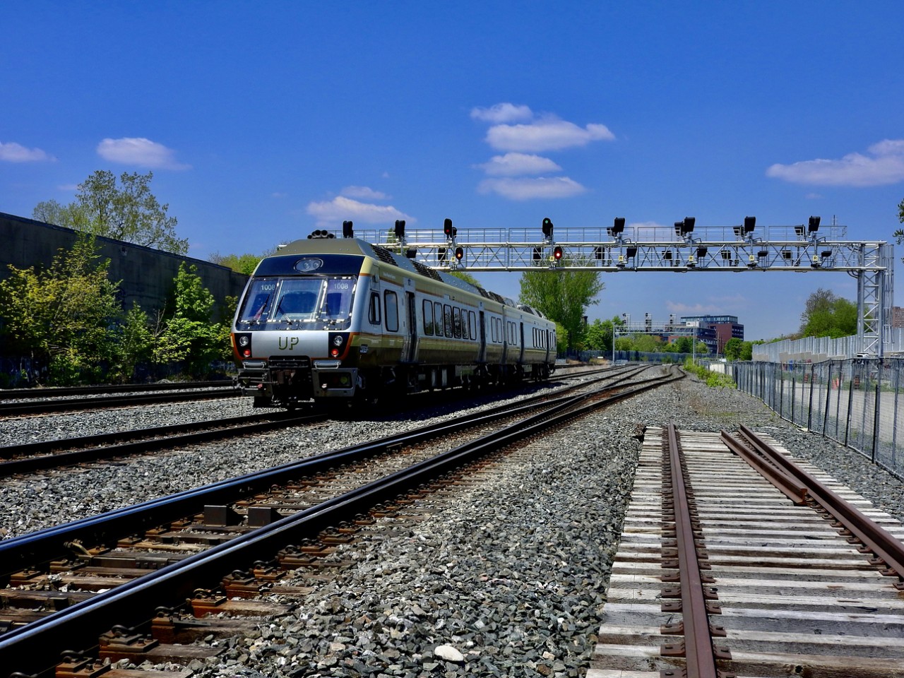 Up, up and away. UP 1008E heads towards Toronto Union Station from Toronto Pearson Airport on Metrolonx's Weston Sub. With Covid travel restrictions still in place, these airport express trains are very lightly traveled these days.