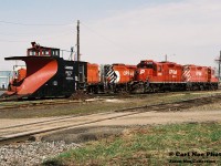In a follow-up to Steve's recently posted photo of Ontario Southland Railway’s former CP GP9u's working the St. Thomas Subdivision in 2020, two decades prior the CP yard in Woodstock was a much different looking place where these unit’s called home. Here on a quiet weekend morning, the St. Thomas Subdivisions power includes: GP9u's, 8208-1516 and 8210-1614 seen idling away along with the Woodstock assigned plow.

