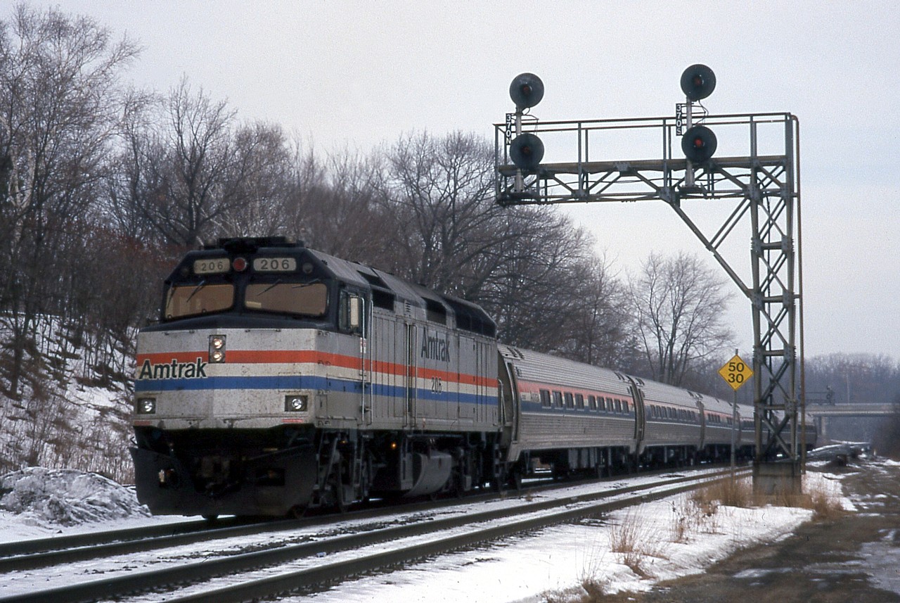 After going through 29 binders of slides spanning roughly 1996 - 2007, I've concluded that I have very few Amtrak photos, and those that I do have I did not go out of my way to get.  Case in point: Feb. 1, 1999 was a P.A. Day, and my Dad dropped me off at Reg Button's house to spend the day with him.  He lived near Kinnear, and the first thing we caught was CP 523 that had NS 8902 in the consist (foreign power was rare at the time).  We, or at least I, photographed it at Kinnear and then we went out to Bayview for another photo.  Those that didn't know Reg need to know that he had a stroke in his later years, and was not the most mobile.  He often drove everywhere he needed to go to get a photo, so that's how we ended up at Bayview Jct., very much trespassing, but I was held against my will!  After photographing CP 523 again, we caught a few CN trains and Amtrak before moving on to Howard Road in Aldershot.  Amtrak had the standard-issue F40PH and five amfleet cars - four coaches and a cafe car.  For a teenager on a budget Amtrak rarely warranted a photo, but on this occasion I must have figured I better take a photo because of where we were.  It was the only day I photographed trains at Bayview Junction proper.  Good old Reggie!