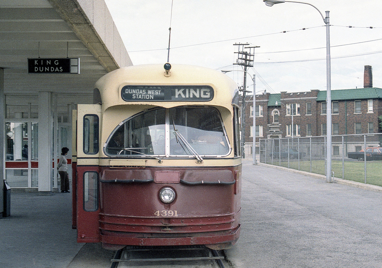 TTC 4391 is in Toronto on a cloudy day in mid-June 1972. I believe this is the Dundas West Station.