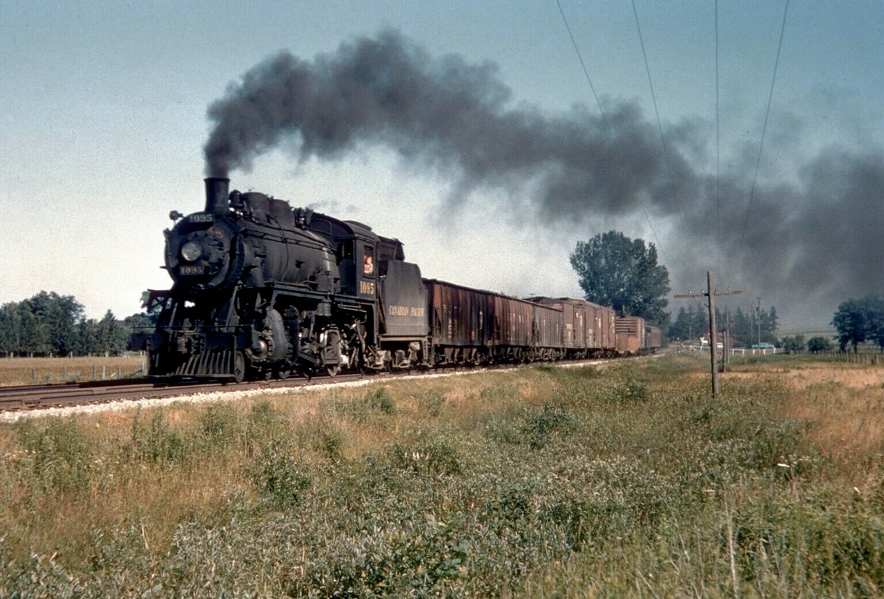 What I think is the West end of Milton, is CP 1095, a D-10h class 4-6-0 which survived the scrappers torch and rests in Kingston, Ontario. Besides the CPR's Angus Shops D10's 600-1111 (507 engs.) were built between 4/1907 and 12/1913 by CLC and MLW as well as Richmond.

Sub-class d, e and f had 22 1/2" x 28" cylinders, 180 lbs boiler pressure and 34,400 tractive effort.
All other sub-classes of D10's had 21" x 28" cyl. 200 lbs. and 33,300 t.e. All have 63" drivers.
Note: a, b, c and d sub-class (600's and 700's) built with Stephenson valve gear.