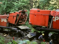 Forty-eight years ago today, on Tuesday 1973-06-12 at mileage 68.3 Victoria sub. near South Wellington on CP’s E&N Division on Vancouver Island, a disregarded train order led to a southbound train with Baldwins 8011 and 8007 and a water car plus caboose colliding with northbound train No. 51 from Victoria with Baldwins 8008 and 8006.  Here are the two leading units the next day, 8011 on right and 8008 on left, slightly separated after the 8007 and two cars had been pulled back to Wellcox yard in Nanaimo.  Consider what could have happened if these units had been equipped with between-trucks fuel tanks like 8000 through 8004 were (with the behind-the-cab tank for steam generator water) for passenger service.