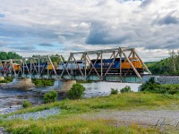 Southbound 214 rumbles across the Montreal River bridge in Latchford.<br><br>
Led by 2102 followed by 1740,  2105, and 1733.<br>
Mile 93.7 Temagami Sub June 19.