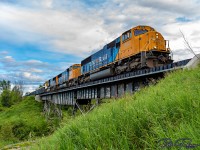 Northbound ONT 113 crosses the Wabi River Bridge in Dymond Township.<br>
Led by ONT 2102 followed by ONT 2103 and ONT 2105.