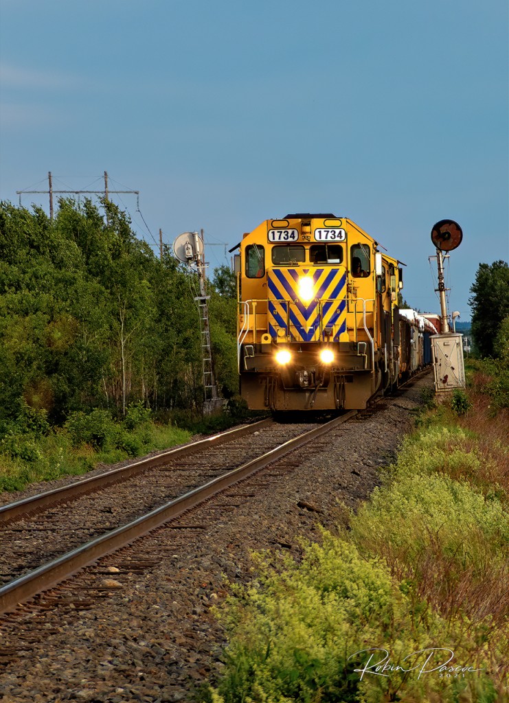 An unexpected 74 car Northbound Freight Extra rolls through the Temagami Sub.
Passing by a pair of defunct signal lights.
Led by ONT 1734 followed by ONT 2202 and ONT 2105. 
A nice mix of Ontario Northland power SD40-2, GP40-2 and SD75I
June 24, 2021 - MP 116 - Temagami Sub