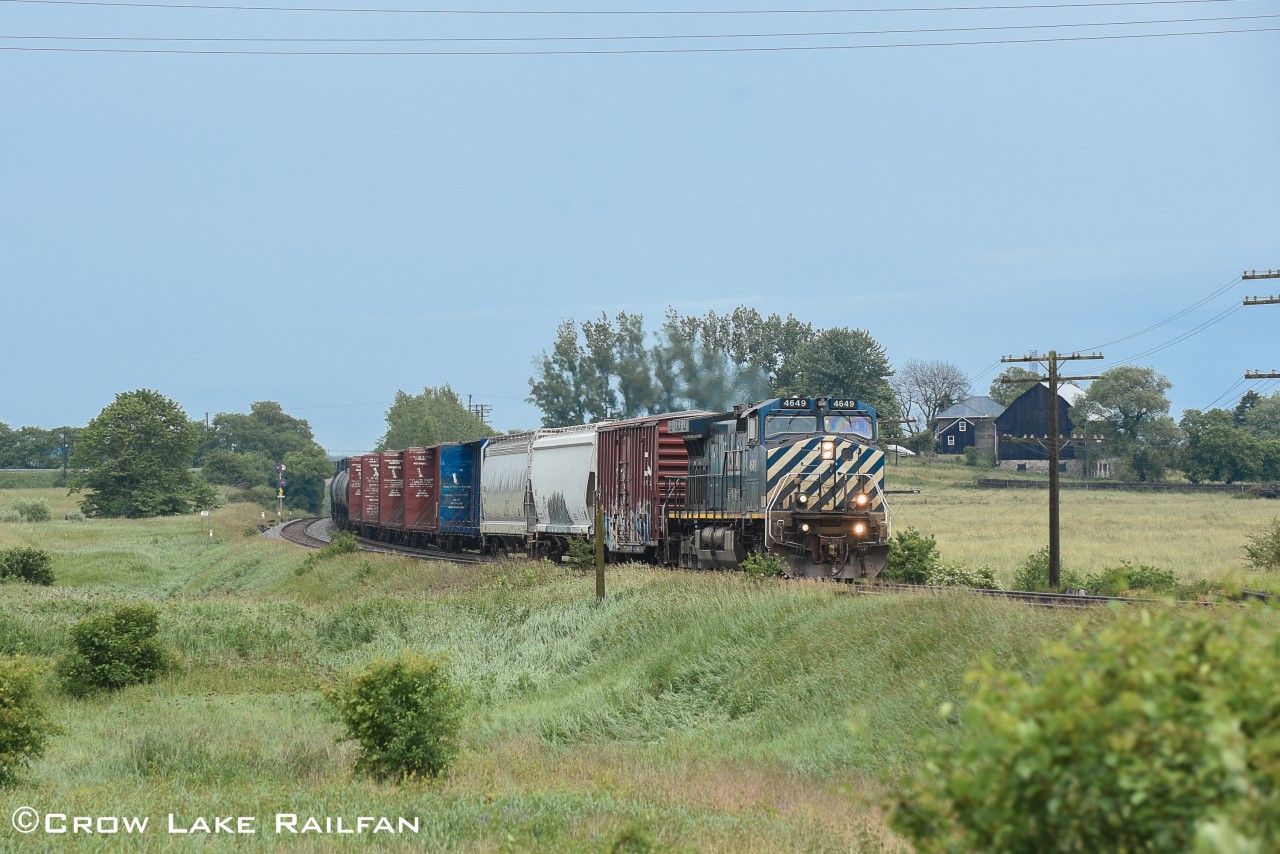 With the rain cleared and sun in the skies CN L517 makes its way past Newtonville with a BCOL unit taking the lead.