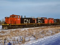 Extra 1082 is leaving Gibbons at 11:05 after stopping to pickup a few cars. It is a longish S bend as they head southwest from Gibbons, which, approx. 2 miles from here, the route will become straight south to St. Paul Jct and connect with the Vegreville Sub. With luck they will be on the shop track by 12:30.