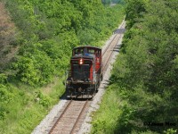 On June 16, 2020 a light work day for the crew of CN L568 required the use of only a solo unit west from Kitchener. Having been set-off by CN L533 the night prior, CN GMD1u 1408 departed Kitchener for Stratford light power and eventually headed west to London to work HCL. Pictured here L568 has just crossed the Nith River and is approaching the Perth Street bridge, just west of the town of New Hamburg. 
<br>
Less than a year later on March 10, CN had retired a large portion of the 1,200 horsepower GMD1’s that were still on the active roster, including units; 1408, 1412, 1437, 1440 and 1444. These units had been placed in storage out of service at CN’s MacMillan Yard in Toronto during the past winter.
