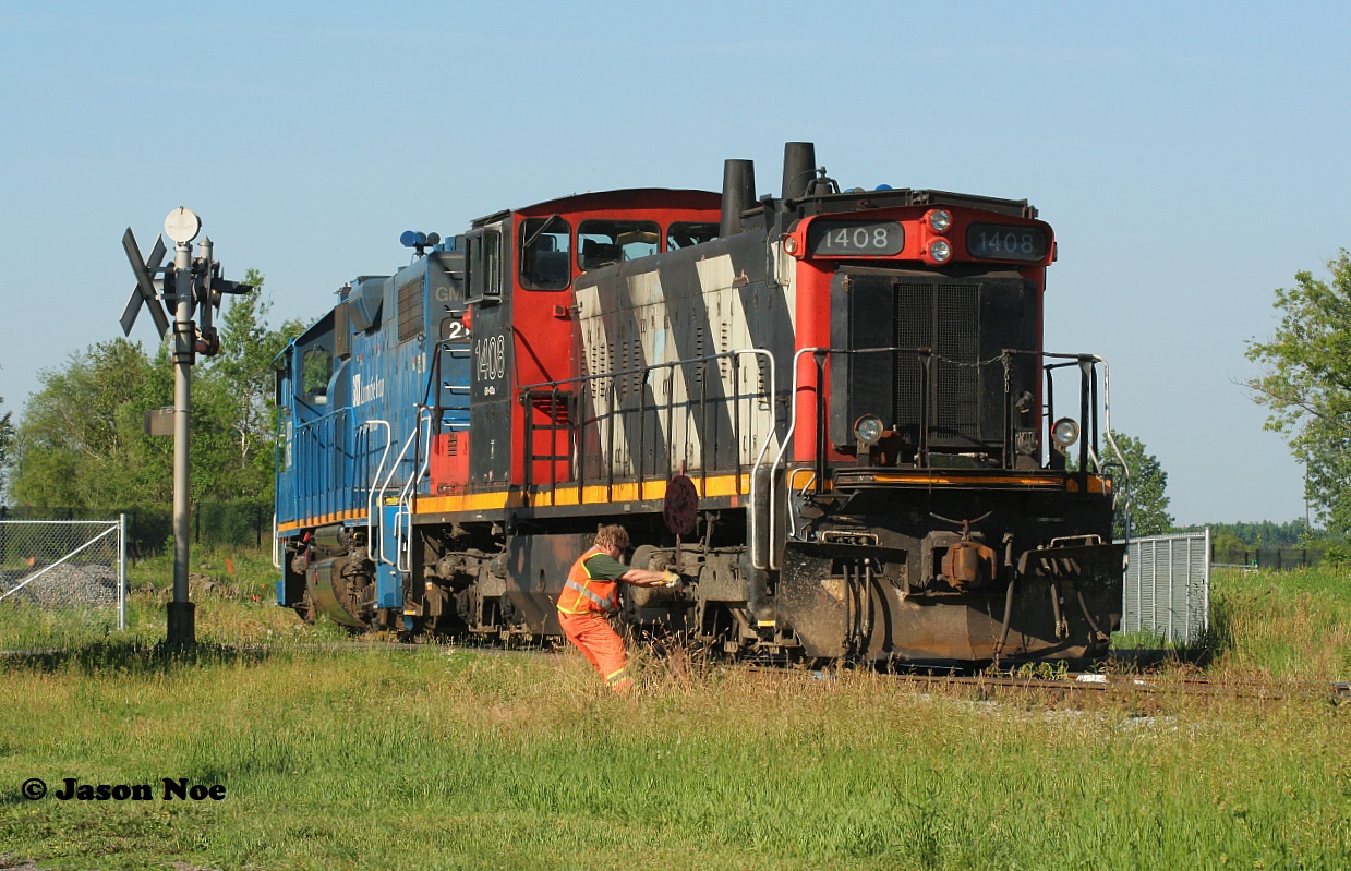 During an early summer morning, back when CN L542 used to work on Sunday's, here CN 1408 and GMTX 2163 switch XV Yard in Guelph as they build their train for industries in the city as well as for the interchange with the Ontario Southland Railway.