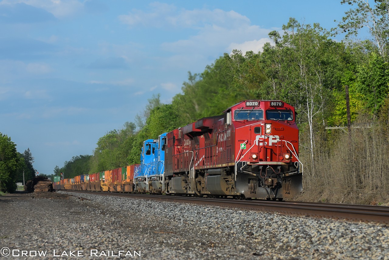 CP 143 rumbles past Bedell with 2 blue CEFX GP20D's trailing. These units were brought up from storage on the CMQ and stayed in the Montreal St. Luc yard for a couple weeks before continuing their journey west.
We're not sure the exact reasoning on why they did this but it was definitely a treat to see something out of the ordinary on an otherwise regular powered 143.