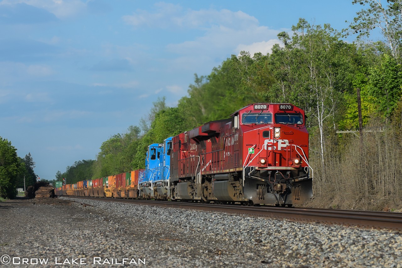 CP 143 rumbles past Bedell with 2 blue CEFX GP20D's trailing. These units were brought up from storage on the CMQ and stayed in the Montreal St. Luc yard for a couple weeks before continuing their journey west.
We're not sure the exact reasoning on why they did this but it was definitely a treat to see something out of the ordinary on an otherwise regular powered 143.
