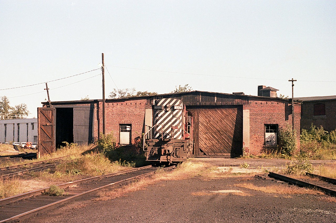 Old CP enginehouse was in downtown Fredericton NB if I remember correctly. I get to wondering when this relic was built. CP 8770 sits out front. I've placed this near the now preserved station, but I'm only guessing. The CPR pulled out of the city back in 1993 so will need a viewer familiar with the area to fill in the details. Photo was shot early morning.