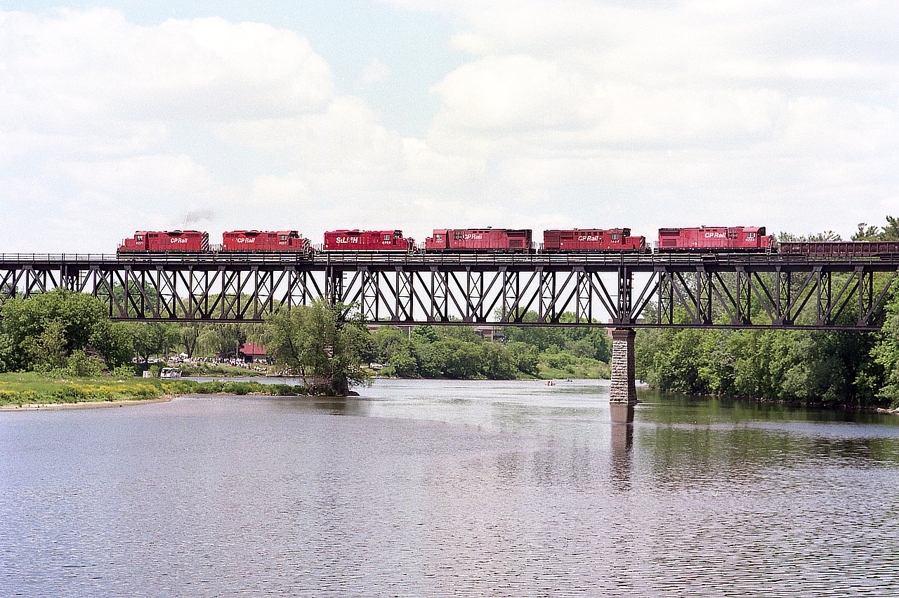 Rolling over the Grand..........CP 8221, 8237, STLH 8206, CP 4231, 1824 and 4223 look impressive out on the bridge. Even more so now, as this image was taken 24 years ago next week; all units in this consist are gone from the CP roster.
