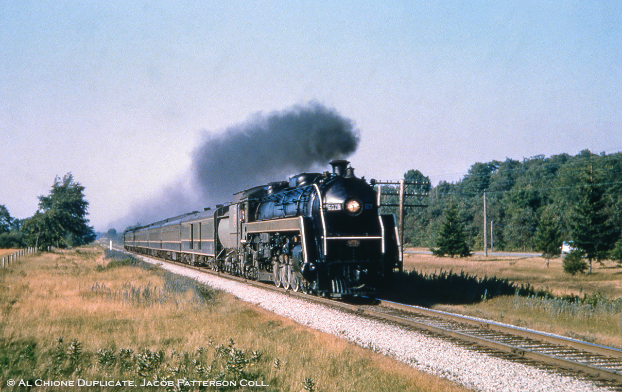 Toronto to London train 11 hustles along the Brampton Subdivision crossing 3rd Line (based on distance to Highway 7 at right) headed for a stop in Guelph, due at 1836h according to the 1956 timetable. Departing Toronto at 1700h Monday through Friday, number 11 will pull into London three hours and forty minutes later at 2040h.U-1-f 6078, built by MLW in December 1944, will languish in storage until meeting the torch in June 1961.Original Photographer Unknown, Al Chione Duplicate, Jacob Patterson Collection Slide.
