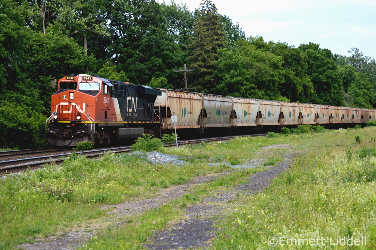 CN B731 races through Paris pulling a string of empty potash cars, destined for Saskatchewan. The locomotives were both CN ESS44ACs 2942 & Mid Train DPU 2859 (Not Pictured).
