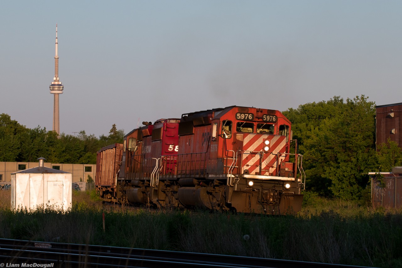 It Don't Get Much Better Than This

Here on a beautiful June day we see CP 9-WGA-08, a Herzog GPS Ballast train take the curve at the West Toronto Junction in some perfect evening light with a pair of classic GMD SD40-2s providing the motive power. Just the lighting and engines alone would make for an amazing catch, but what some of you may not know is that the section of track this train is on is otherwise passenger-only, as the only reason it still exists is so the GO Milton Line trains can enter and exit the Union Station Rail Corridor to and from the Galt Sub. CP owns it though, so they have to maintain it just as if it were any other part of mainline trackage they own. Today, they needed to dump ballast starting at milepost 3 of the Galt, which is located around Sorauren Avenue Park on the section where the Galt & Weston subs parallel each other before both lines amalgamate into the USRC. This meant they had to pull up past the junction, wait for the last Milton GO of the evening to clear, and then back down to where they needed to drop the rocks. After finishing their work down there, they’d continue to dump until mile 17, where they would run around their train and head back east. 

Especially in the year 2021, it truly does not get much better than this right here.