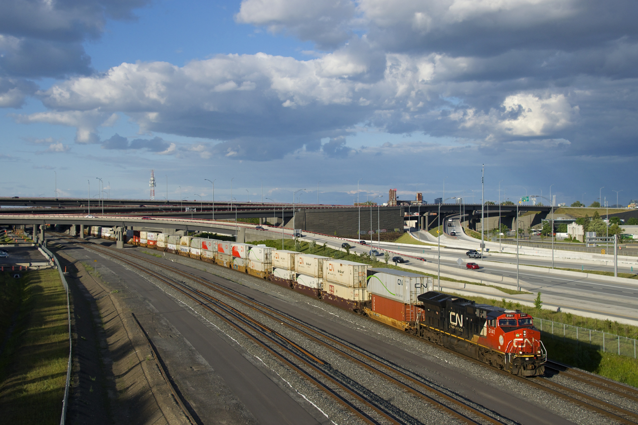 CN 3141 is the only head end unit as CN 121 heads west under dramatic skies.
