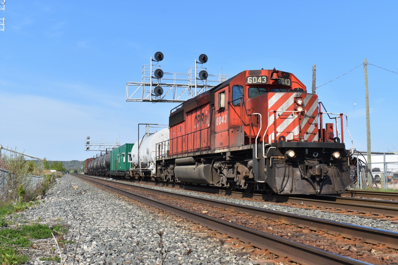 CP Rail 3WED-15 with CP SD40-2 6043 in the lead powers the vegetation control train through Milton, ON at Mile 31 of the CP Galt Sub on a sunny saturday morning.