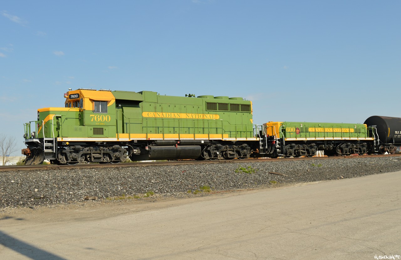 Proudly wearing "Canadian National Green", the 2300 West Control assignment with CN 7600 (was 4728) and CN 600 (was 503) stands in the clear on an overtime move as 385 departs and some trucks need to cross, once everything settles they'll pull this track out of the bowl, "down the Green" and shove it into a track at West Control behind for another Westbound train to grab later. Another day underway at West! I guess there's been some conversation about the green, personally I don't see what the fuss is about. I think this pair looks fantastic and it's caught my eye around the yard a few times now! Very striking and cool to see in person, a job well done by CN. Taken by an off duty employee while wearing all required PPE.