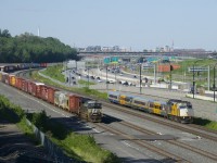 Wrapped VIA 6420 leads VIA 69 past parked CN 529 as it heads to its next stop at Dorval Station.