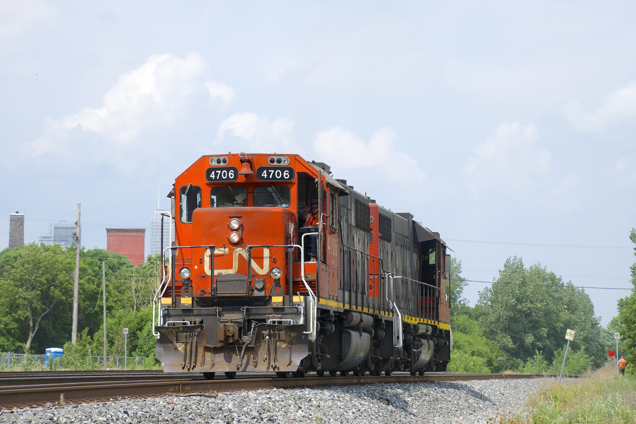 After bringing a single boxcar to the Kruger plant, CN 4706 & CN 4707 are leaving the Turcot Holding Spur light power. Having already received permission from the RTC to enter the south track of CN's Montreal Sub at MP 3.85, the power is heading east with the conductor in place to throw the switch once the power has passed him.
