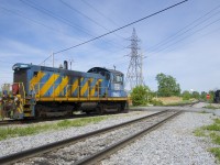 The only two games in the town of Beauharnois are visible as the ex-Port of Montreal SW1001 temporarily takes a break from its switching duties at the Axiall plant while a crewmember gets ready to throw a switch. At right CSXT 6247 is getting ready to head towards the Diageo distillery to pick up some cars.
