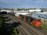 CN 8839 & IC 2725 are in charge of CN 321 as it passes through Montreal West.