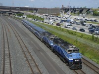 Consecutively numbered F59PH's (AMT 1345 & AMT 1346) are leading EXO 1207 as it passes afternoon rush hour traffic.