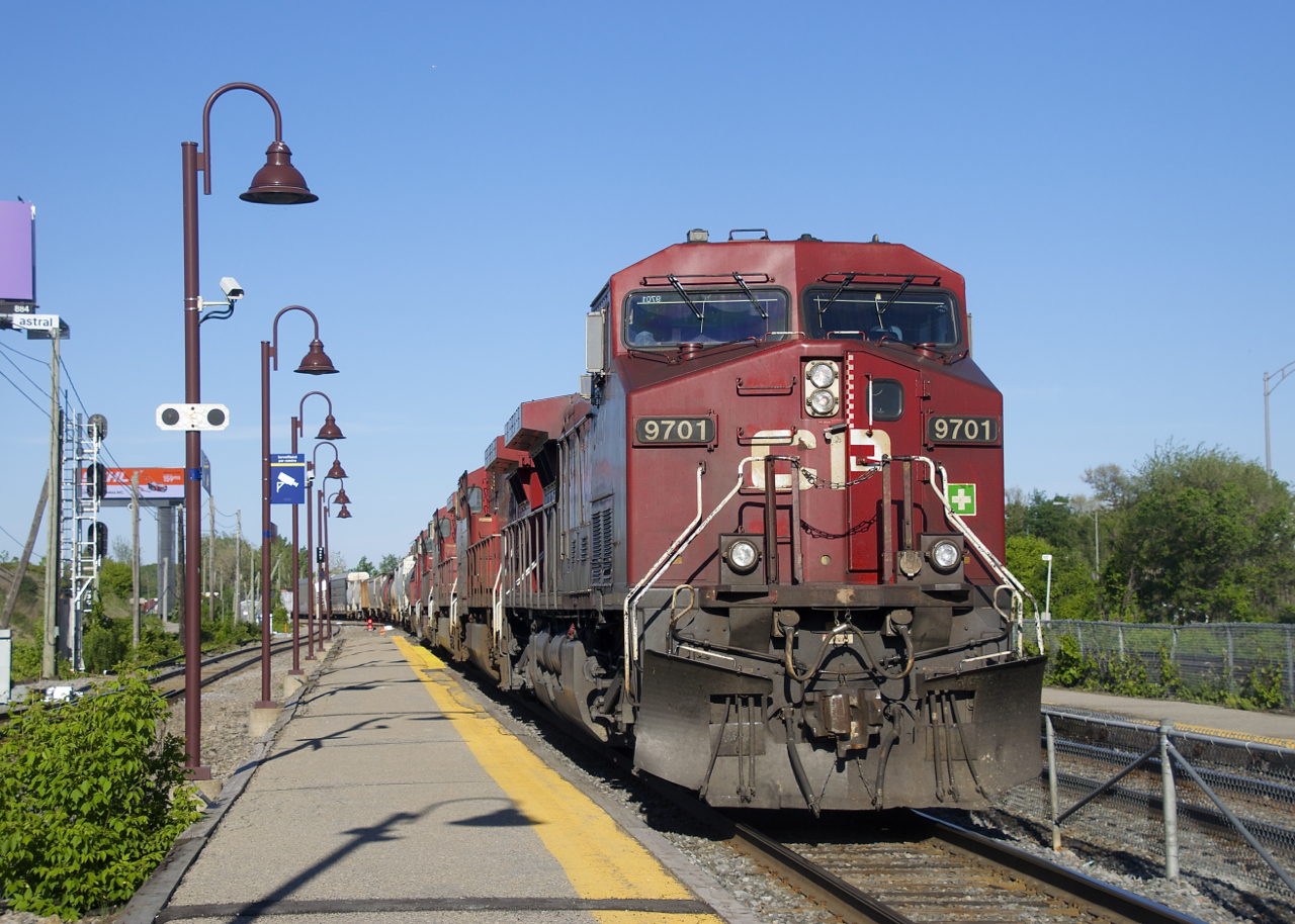 CP 119 has five GE units up front (CP 9701, CP 8532, CP 9765 CP 8551 & CP 8056) as it sits stopped at Lachine Station before backing up and lifting cars at the Lachine IMS Yard.