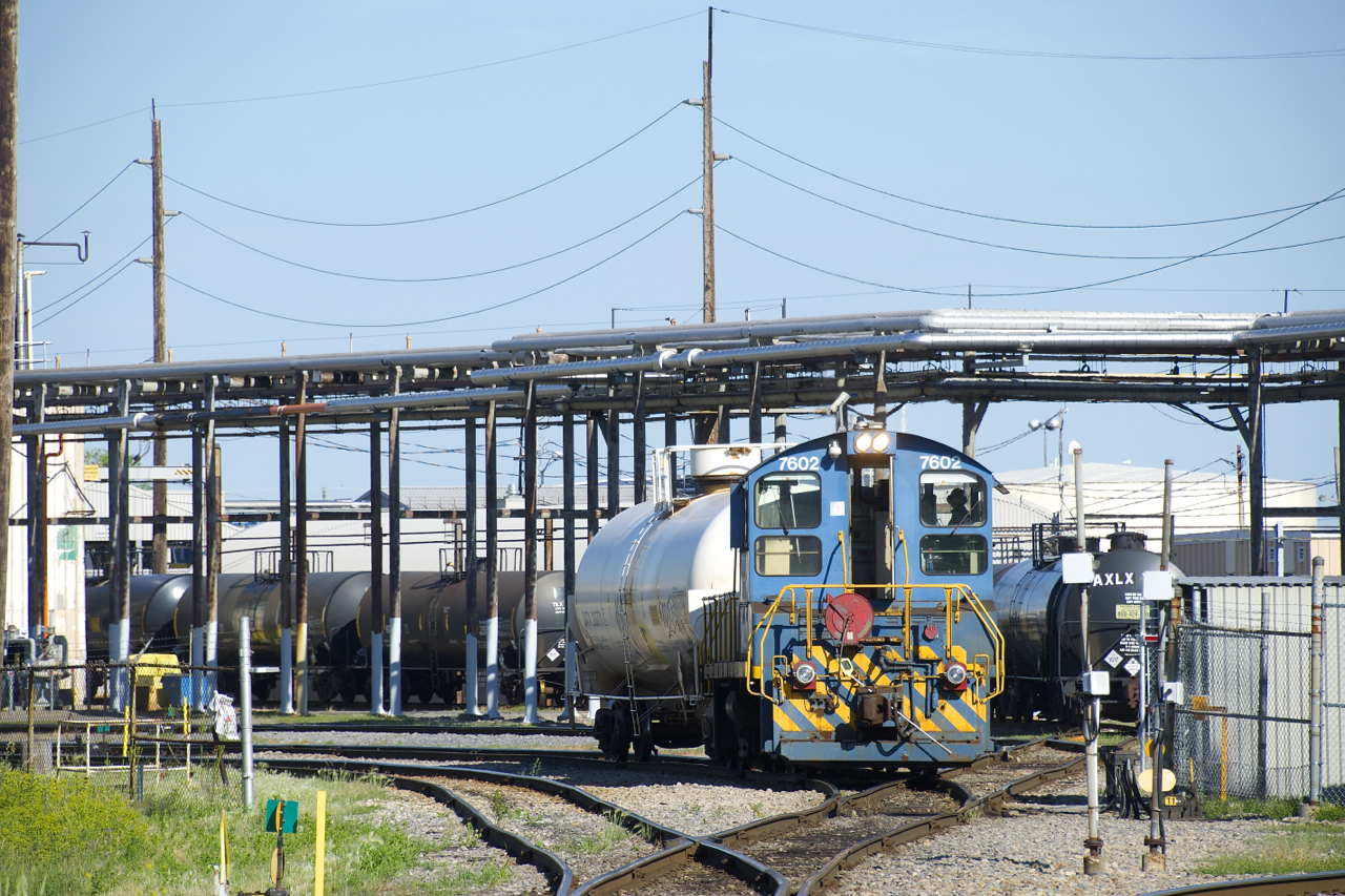 An ex-Port of Montreal SW1001 is switching tank cars inside the Axiall plant in the morning.