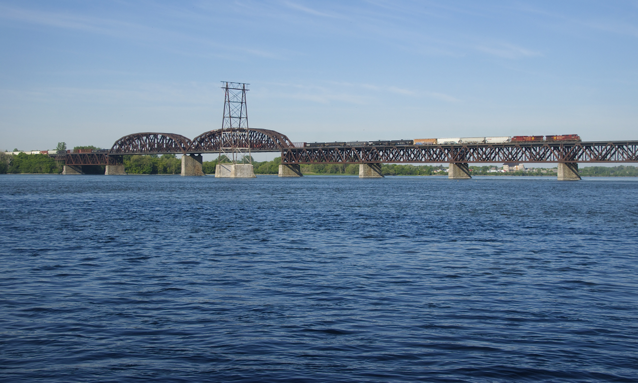 A pair of AC4400CW's (CP 9832 & CP 9803) lead CP 253 on CP's double-track bridge over the St. Lawrence River.
