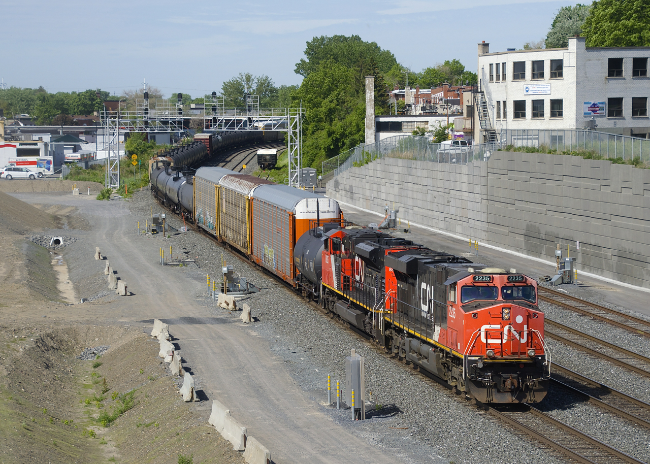 CN 306 with CN 2235 & CN 8825 for power are slowly approaching Turcot Ouest for a crew change.