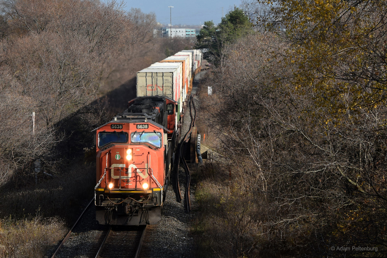 This spot just west of Liverpool along the first stretch of the York Sub was my favourite place to watch trains as a kid, as I grew up in a house just a short walk from here. Back during the early 2000's you could still see some second generation diesels in their last years of leading mainline freight trains. I was too young at the time to get any pictures, besides one crappy shot of an ex-MoPac SD40-2, and suddenly I lost my chance when my family moved us two towns away a decade or so ago. I hadn't thought to come back until late last year, which is when I snapped this photo of CN Q147 starting up the hill on its way to Toronto. Winter was near and it's apparent with the long shadows cast by the train despite it only being just after 1pm!