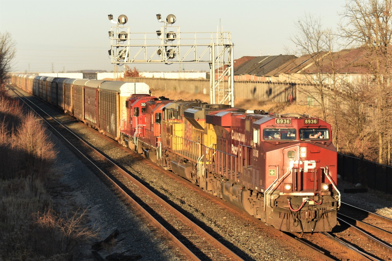 CP 147 fly's through the Milton East switch during Golden hour with a rather Unique combo of an ES44AC, UP SD70ACE, a CP GP38AC still in the CP action red paint (3018), and CP GP38-2 3042