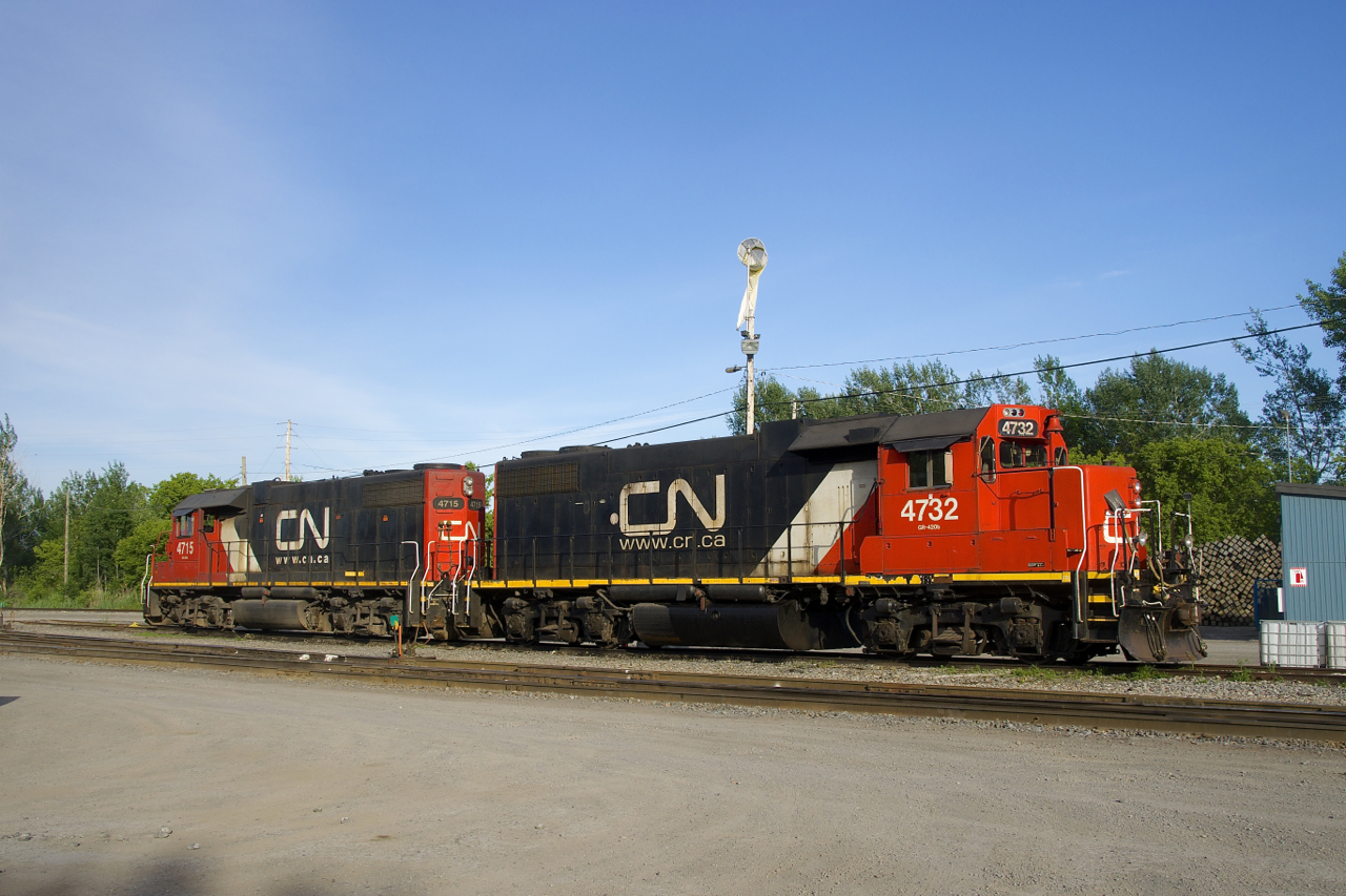 A pair of clean GP38-2's (CN 4732 & CN 4715) lay over at Coteau on a warm spring evening.