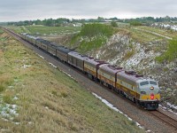CP 41B heads home to Calgary through Tomkins Saskatchewan on a cool, dreary May long weekend. 