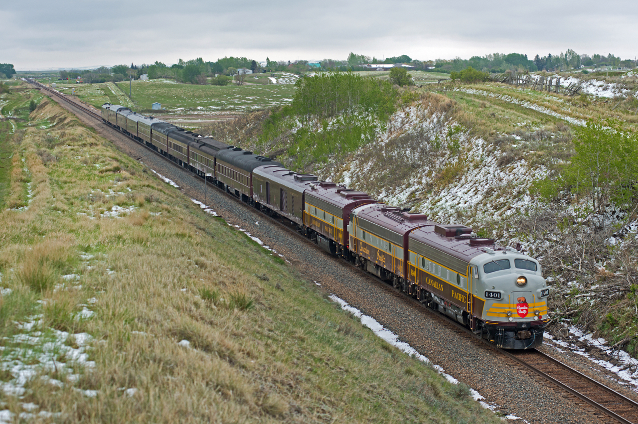 CP 41B heads home to Calgary through Tomkins Saskatchewan on a cool, dreary May long weekend.